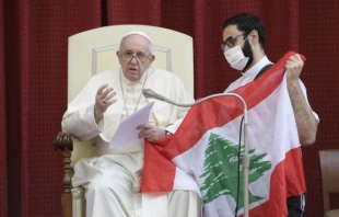 Pope Francis with the flag of Lebanon at a general audience at the Vatican, Sept. 2, 2020. Vatican Media.